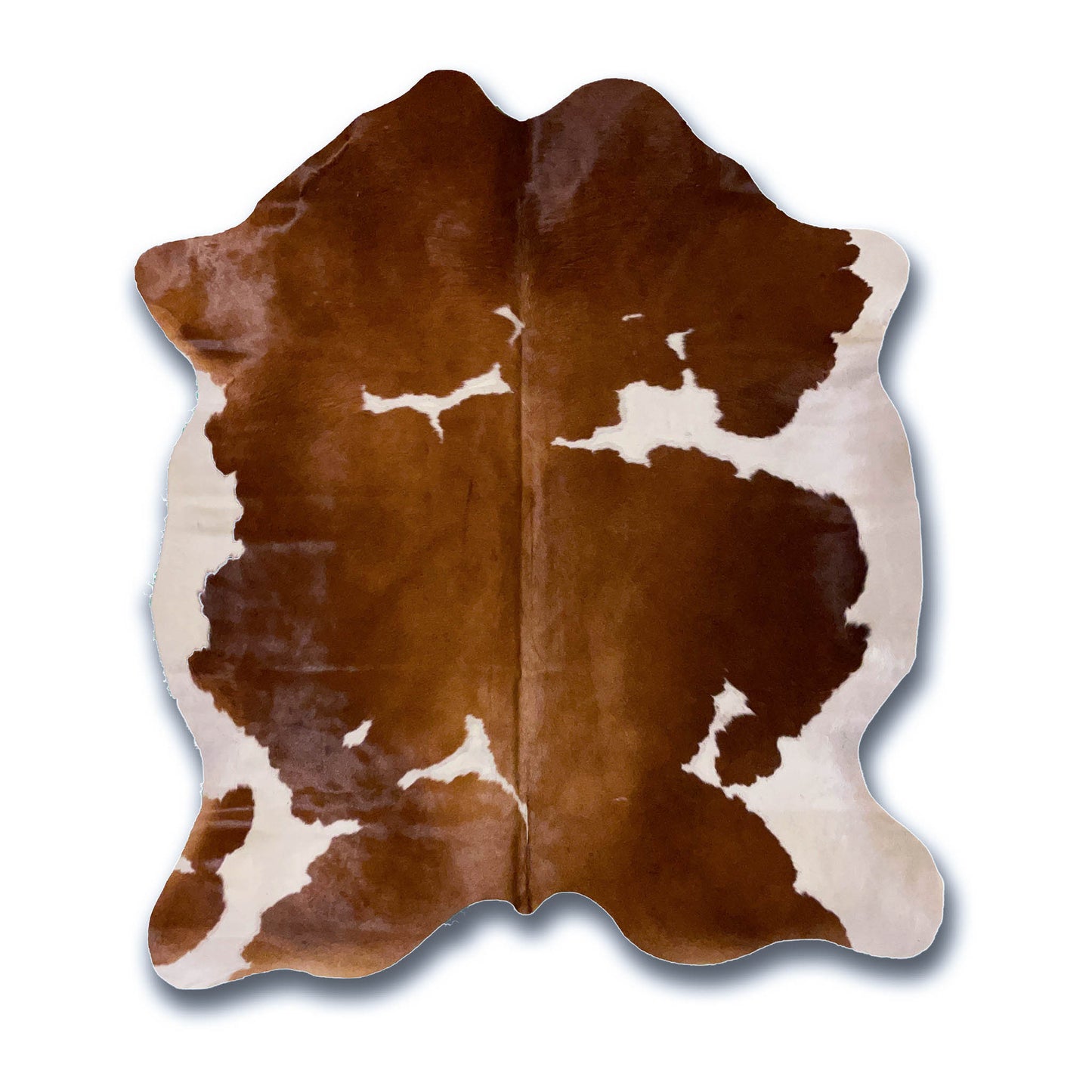 Brown and White Cowhide Rug